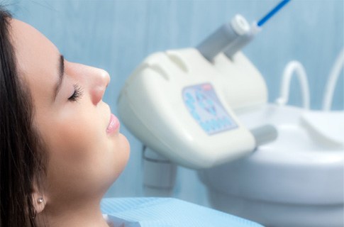 Female periodontal patient sitting back and relaxing